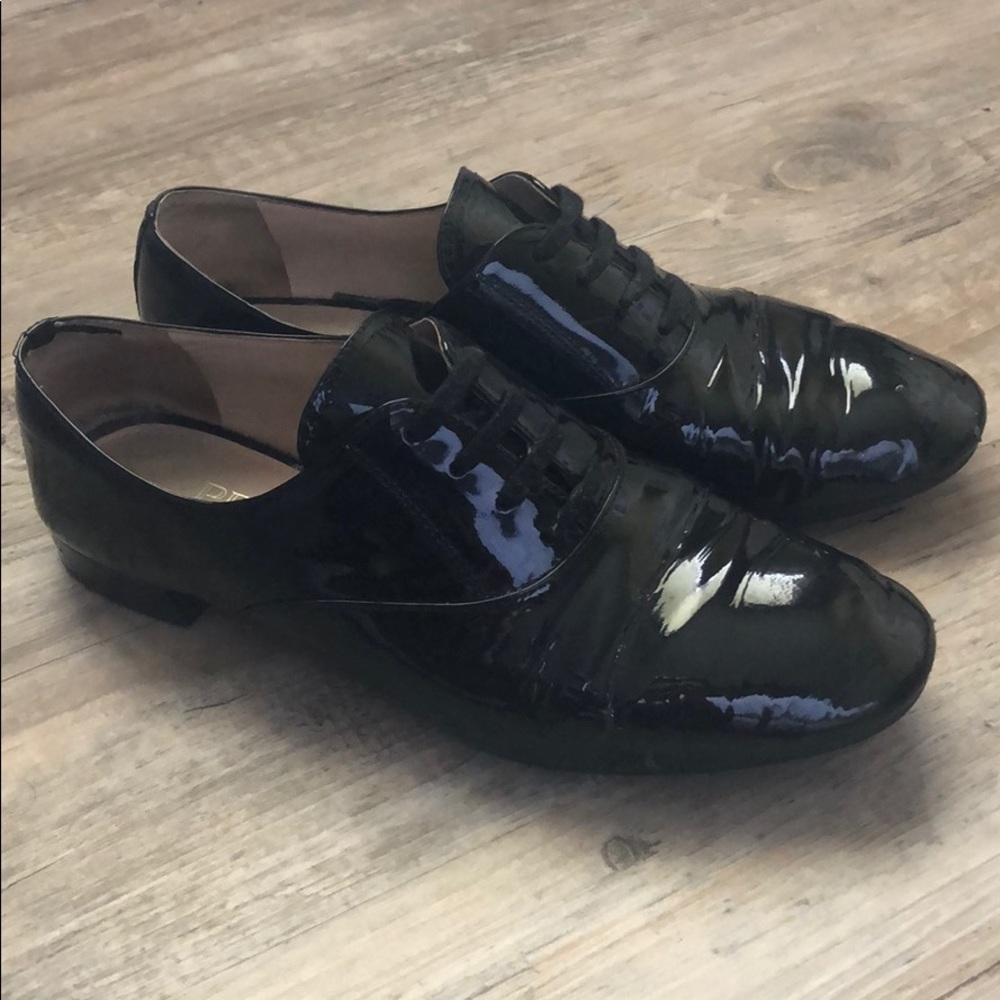 Prada patent black oxfords
